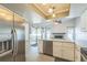 Modern kitchen featuring stainless steel appliances and an open layout leading to the living area at 2204 78Th W St, Bradenton, FL 34209