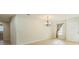 Inviting living room featuring light wood floors, natural light, and chandelier at 2204 78Th W St, Bradenton, FL 34209