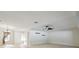 Bright and airy living room with light wood floors, natural light, and ceiling fan at 2204 78Th W St, Bradenton, FL 34209