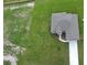 Birds eye view of a gray home with a gray roof and an extended driveway on an oversized lot at 2330 Hiers Rd, Dover, FL 33527