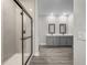 Contemporary bathroom featuring a walk-in shower, dual sinks, and modern fixtures at 2330 Hiers Rd, Dover, FL 33527