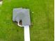 An aerial view of a well-maintained home, showcasing its neat roof, driveway, and surrounding green lawn at 2402 Hiers Rd, Dover, FL 33527
