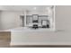 Modern kitchen with stainless steel appliances, grey cabinets, white countertops, and a stylish backsplash at 2414 Hiers Rd, Dover, FL 33527