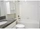 Bright bathroom featuring a tub, shower, and granite sink at 24815 Lambrusco Loop, Lutz, FL 33559