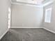 Spacious bedroom with tray ceiling, carpet floors and lots of natural light at 24815 Lambrusco Loop, Lutz, FL 33559
