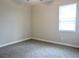 A standard bedroom with neutral walls and carpet at 24815 Lambrusco Loop, Lutz, FL 33559