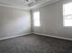 Bright bedroom with carpet floors and tray ceiling at 24815 Lambrusco Loop, Lutz, FL 33559