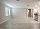 Open concept floor plan with tile floors and view to kitchen at 24815 Lambrusco Loop, Lutz, FL 33559