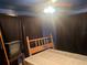 Simple bedroom with ceiling fan, unmade bed, and covered mattress at 25425 Olympia Rd, Brooksville, FL 34601