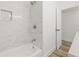 Renovated bathroom features a soaking tub with white marble surround and fixtures at 2554 Lake Ellen Cir, Tampa, FL 33618