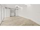 Bedroom features a closet with sliding barn doors and hardwood floors at 2554 Lake Ellen Cir, Tampa, FL 33618