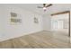 Bright bedroom with two windows and hardwood floors at 2554 Lake Ellen Cir, Tampa, FL 33618