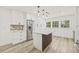 Bright kitchen features an island with seating and stainless steel appliances at 2554 Lake Ellen Cir, Tampa, FL 33618