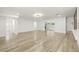 Open-concept living room with light hardwood floors, neutral paint, and modern finishes at 2554 Lake Ellen Cir, Tampa, FL 33618