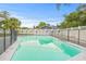 Inviting swimming pool with safety fence, perfect for enjoying a refreshing dip on warm days at 2554 Lake Ellen Cir, Tampa, FL 33618