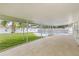 Enjoy the screened patio with views of the manicured lawn and private pool at 2554 Lake Ellen Cir, Tampa, FL 33618