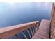 Stairs lead down to the tranquil lake, perfect for boating or simply enjoying waterfront serenity at 2648 Sabal Springs Dr # 2, Clearwater, FL 33761