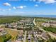 Stunning aerial view of the neighborhood, showcasing lush landscaping and proximity to the ocean at 2708 Dolphin Watch Ct, Holiday, FL 34691