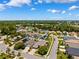 High aerial view highlighting the residential area, street layout, and lush surroundings at 2708 Dolphin Watch Ct, Holiday, FL 34691