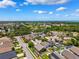 Aerial neighborhood shot showcasing well-maintained homes, swimming pools, and mature landscaping at 2708 Dolphin Watch Ct, Holiday, FL 34691