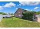 Beautiful backyard with privacy fence, lawn, and fire pit area at 2708 Dolphin Watch Ct, Holiday, FL 34691