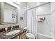 Bathroom features a shower and tub combination, granite countertops, and framed mirror at 2708 Dolphin Watch Ct, Holiday, FL 34691