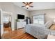 Bedroom has hardwood floors, a ceiling fan and an adjoining room at 2708 Dolphin Watch Ct, Holiday, FL 34691