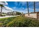 Key Vista entrance sign with stone detail, set amongst lush greenery under a bright, blue sky at 2708 Dolphin Watch Ct, Holiday, FL 34691