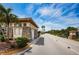 Community gatehouse with stone accents and decorative trim, offering a secure entrance at 2708 Dolphin Watch Ct, Holiday, FL 34691