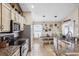 Bright kitchen with granite countertops, stainless steel appliances, breakfast bar, and lots of storage at 2708 Dolphin Watch Ct, Holiday, FL 34691