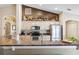 Well-equipped kitchen with granite countertops, stainless steel appliances, breakfast bar, and modern finishes at 2708 Dolphin Watch Ct, Holiday, FL 34691