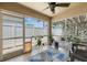 Enclosed lanai with ceiling fan, tile floor, and access to the backyard at 2708 Dolphin Watch Ct, Holiday, FL 34691