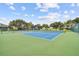 Community tennis courts featuring well maintained blue courts at 2708 Dolphin Watch Ct, Holiday, FL 34691
