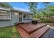 Elevated deck with seating and fire pit offers outdoor living space with a view at 300 33Rd N Ave, St Petersburg, FL 33704