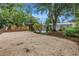 Spacious backyard with a gravel area, patio, and lush landscaping at 300 33Rd N Ave, St Petersburg, FL 33704