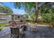 Backyard patio with outdoor seating, a fire pit, and a well-maintained wooden deck at 300 33Rd N Ave, St Petersburg, FL 33704