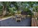 Backyard patio area with outdoor furniture and lush green landscaping at 300 33Rd N Ave, St Petersburg, FL 33704