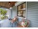 Inviting front porch with seating and a view of the neighborhood at 300 33Rd N Ave, St Petersburg, FL 33704