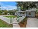 Charming home with a white picket fence and a well-manicured front yard at 300 33Rd N Ave, St Petersburg, FL 33704