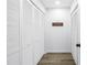 Hallway with multiple closets and a 