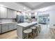 Spacious kitchen featuring an island with bar stool seating, stainless appliances, and ample cabinet space at 300 33Rd N Ave, St Petersburg, FL 33704