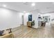 Open-concept living room with a breakfast bar and bright white walls at 300 33Rd N Ave, St Petersburg, FL 33704