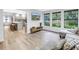 Open-concept space connecting the living room and kitchen with stylish furniture and abundant natural light at 300 33Rd N Ave, St Petersburg, FL 33704