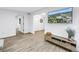 Living room featuring sleek modern decor, light wood floors, and a large TV, creating a comfortable and stylish space at 300 33Rd N Ave, St Petersburg, FL 33704