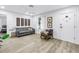 Modern living room featuring hard wood floors and a cozy grey sofa at 300 33Rd N Ave, St Petersburg, FL 33704