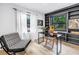 Bright home office boasts natural light, a sleek black desk, and custom built-in shelving at 300 33Rd N Ave, St Petersburg, FL 33704