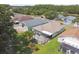 This backyard is complete with a screened in patio, green lawn and mature trees at 30918 Burleigh Dr, Wesley Chapel, FL 33543