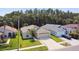 Desirable single-story home featuring lush landscaping, mature trees and a large driveway leading to the 2 car garage at 30918 Burleigh Dr, Wesley Chapel, FL 33543