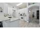 Spacious kitchen featuring stainless steel appliances, white cabinets, and granite countertops at 30918 Burleigh Dr, Wesley Chapel, FL 33543