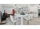 Open living and kitchen area perfect for entertaining, featuring modern finishes and ample natural light at 30918 Burleigh Dr, Wesley Chapel, FL 33543